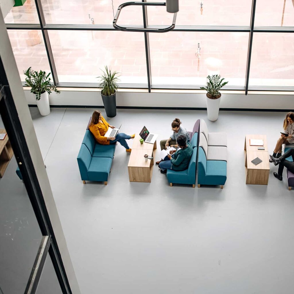 Group of young business people in office cafeteria